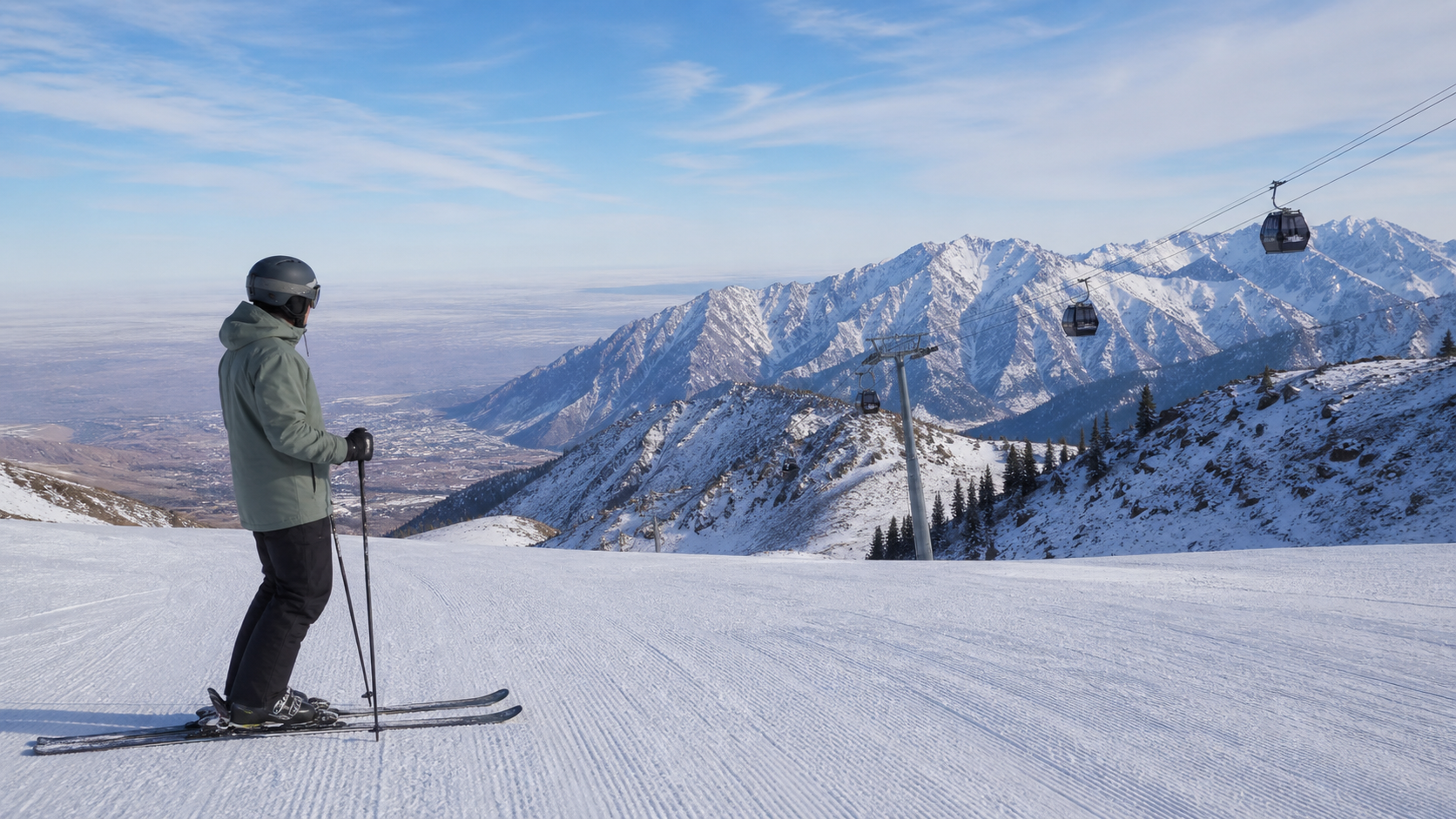 Conceptual skier on a groomed mountain piste with gondolas and snowy ridges
