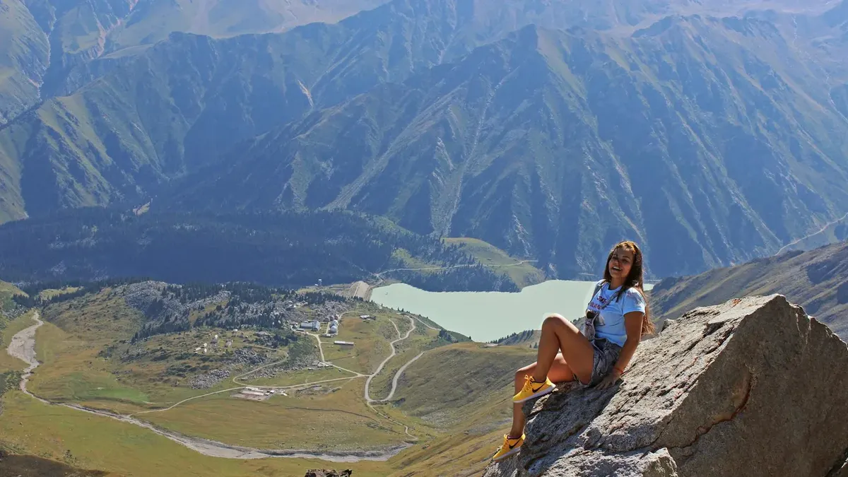 Turquoise Big Almaty Lake surrounded by snow-capped Tien Shan mountains