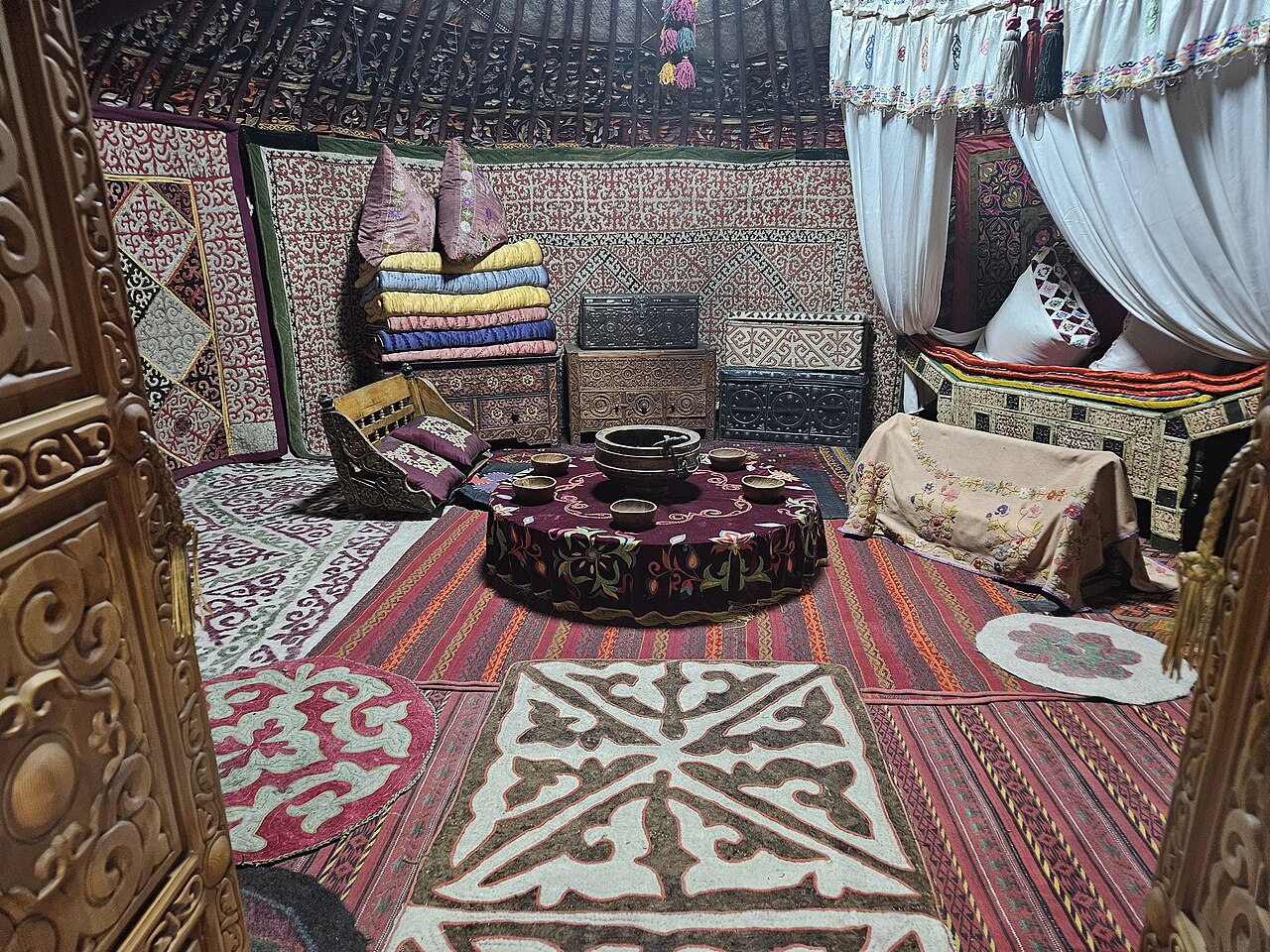 Kazakh cultural symbols including dombra, yurt, and steppe landscape