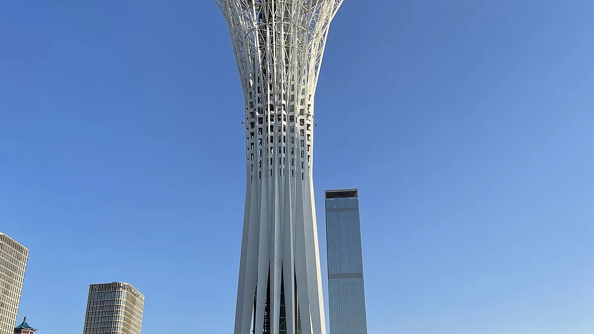 Kazakhstan tourist attractions with Charyn Canyon, turquoise alpine lake, Tian Shan mountains, and Astana skyline