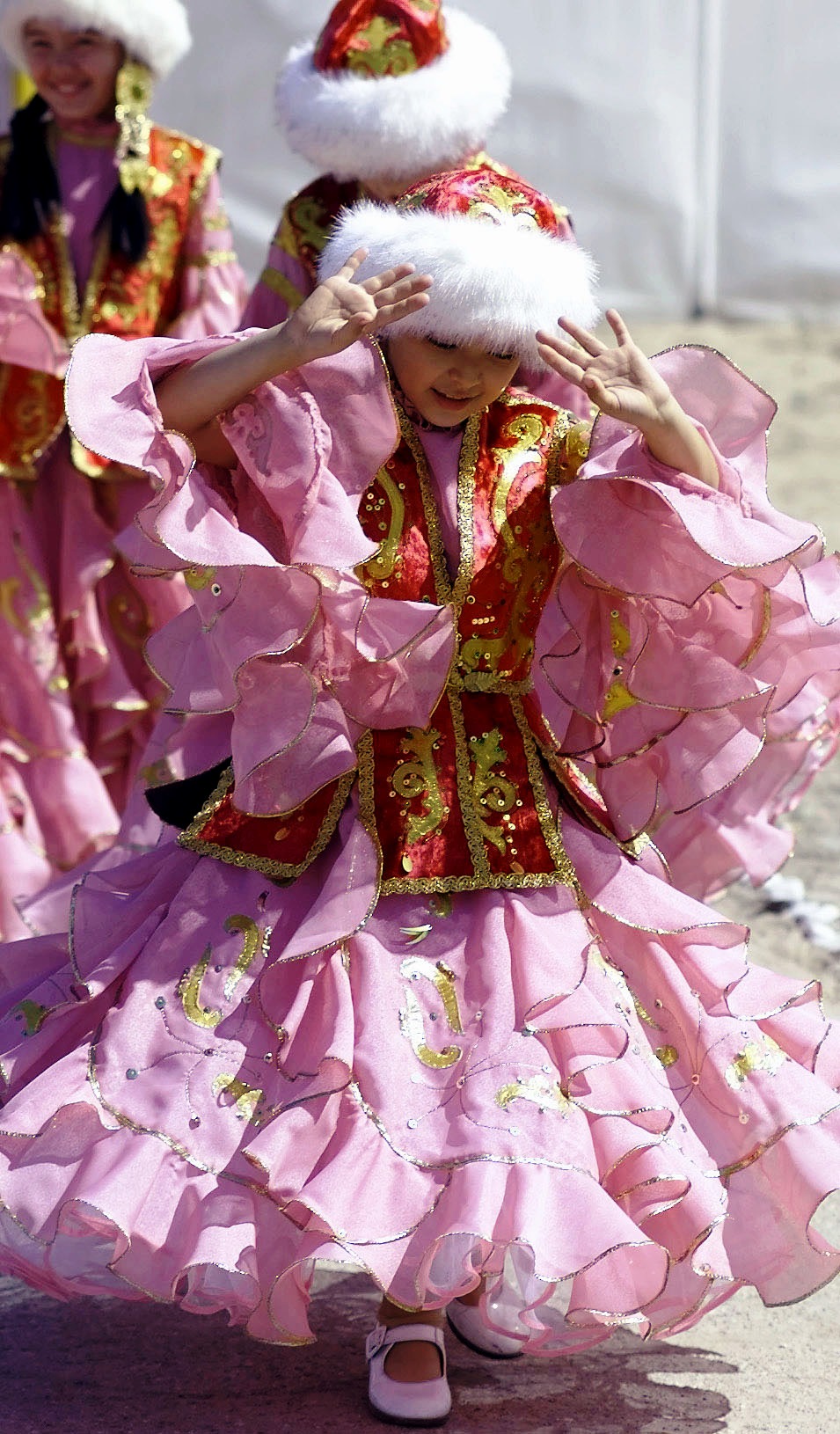 Traditional Kazakh national clothing with embroidered chapan and headdress