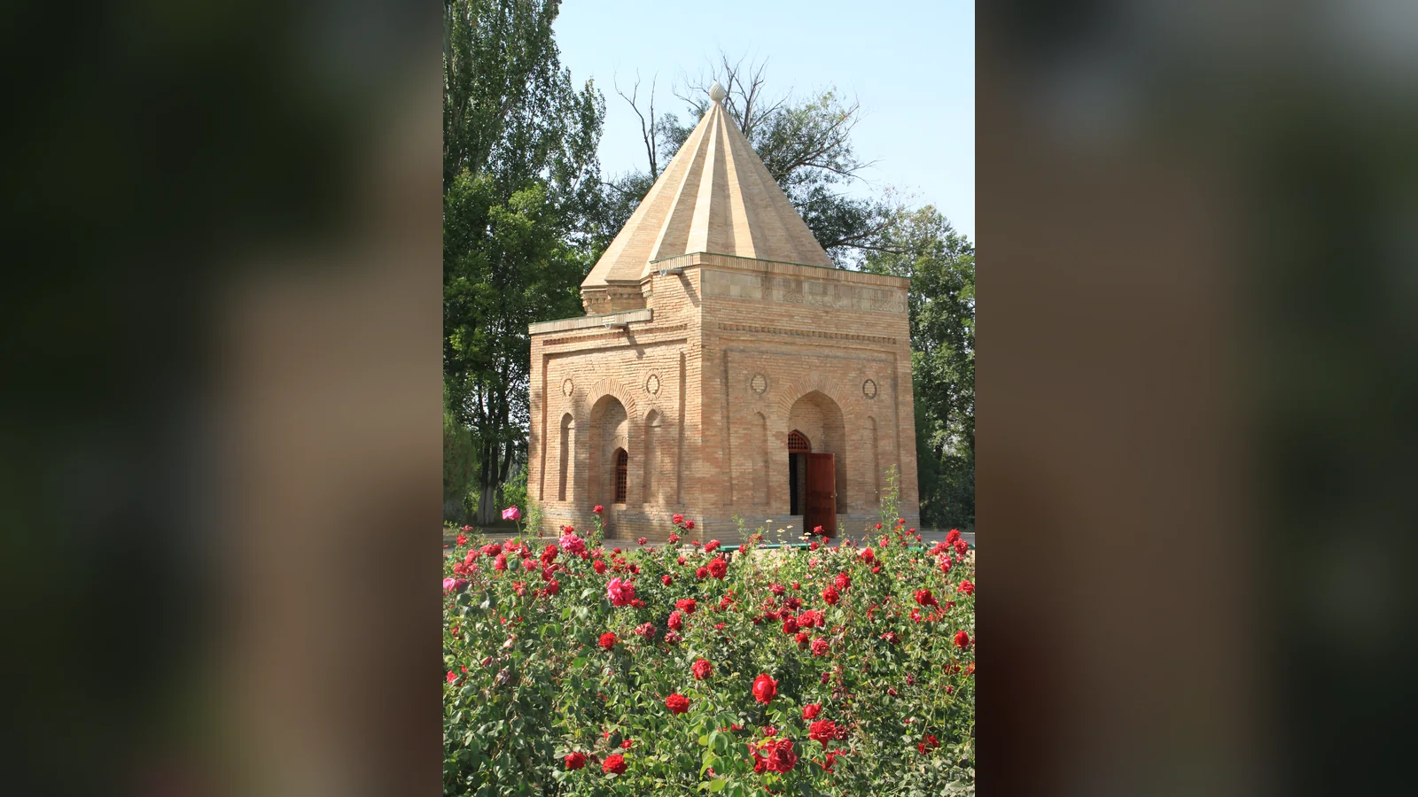 Babaji Khatun Mausoleum near Taraz with roses in the foreground