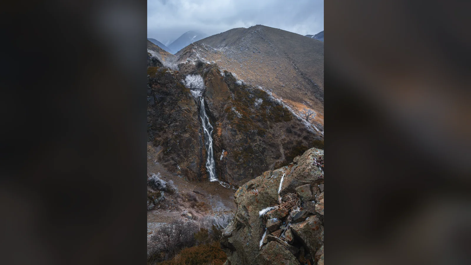 Bear Falls in Turgen Gorge with snow on the surrounding slopes