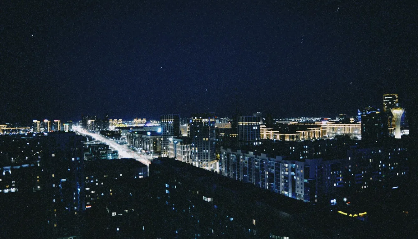 Astana skyline at night with Bayterek tower, Khan Shatyr tent, and illuminated skyscrapers