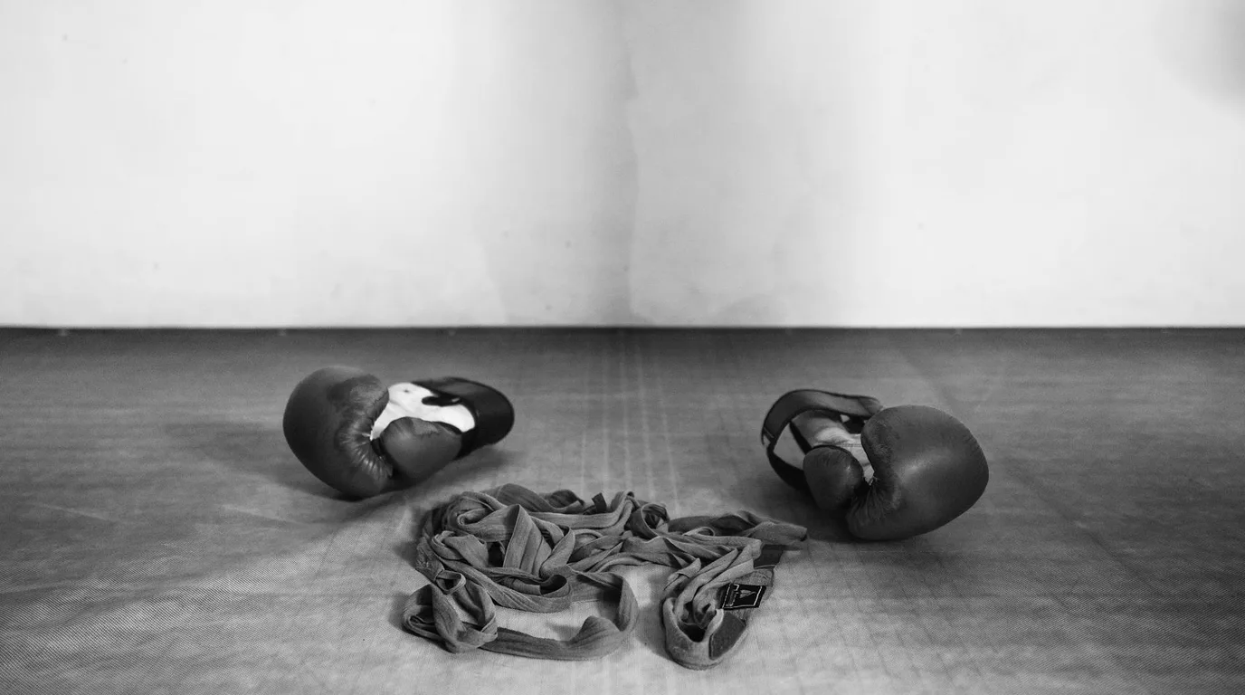 Boxing ring with dramatic lighting representing professional middleweight boxing