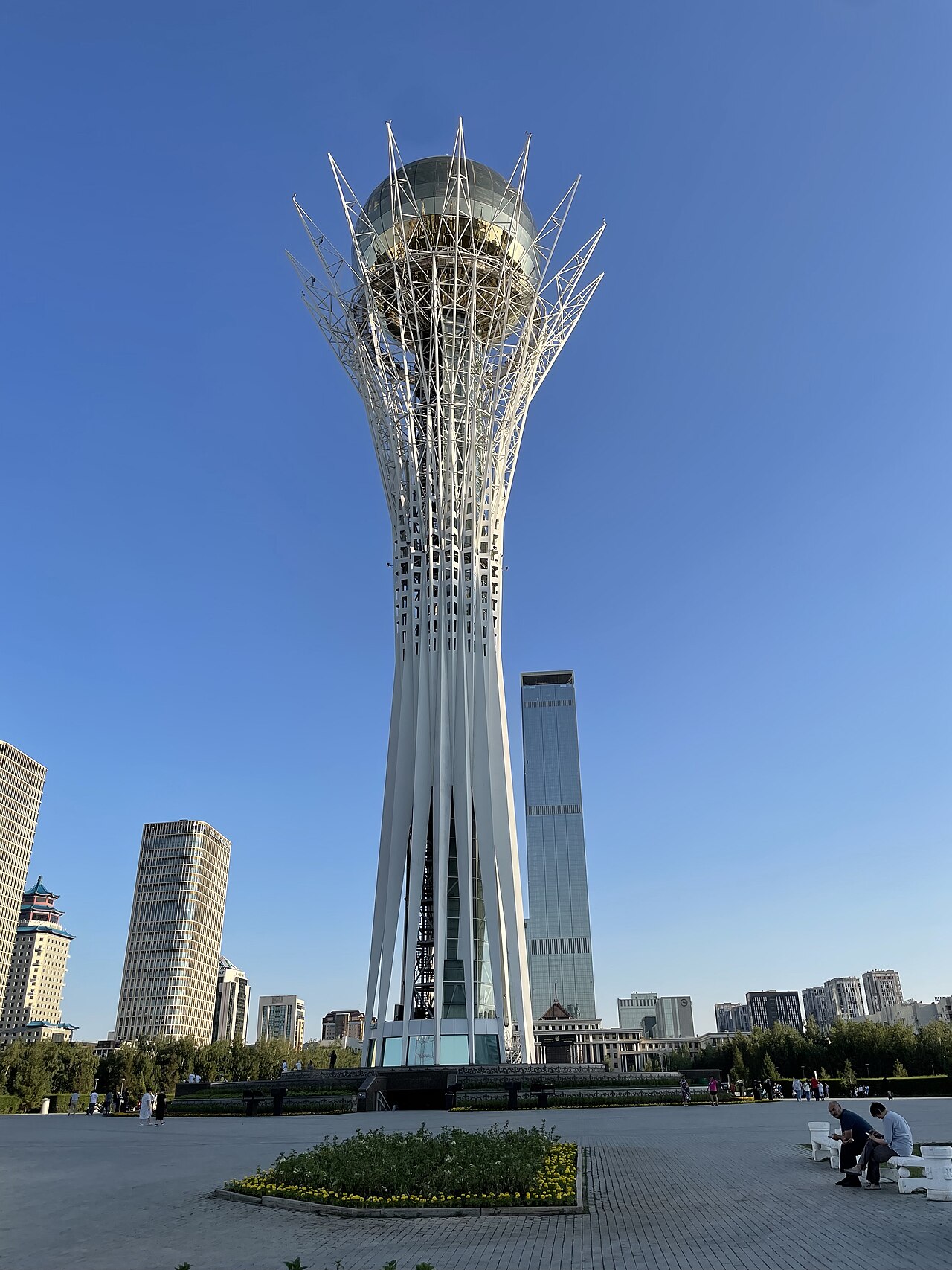 Kazakhstan tourist attractions with Charyn Canyon, turquoise alpine lake, Tian Shan mountains, and Astana skyline