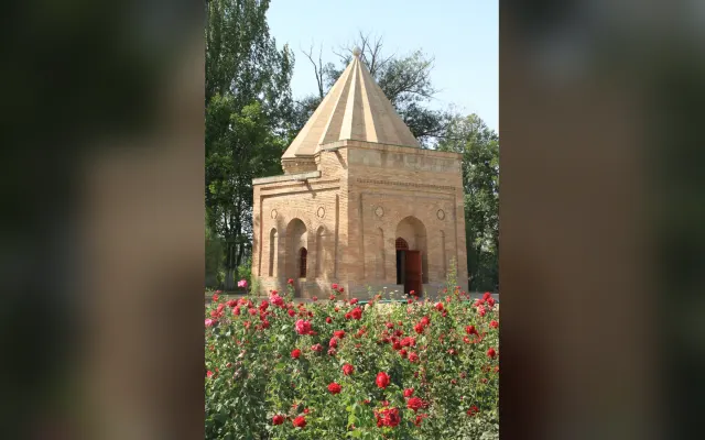 Babaji Khatun Mausoleum near Taraz with roses in the foreground