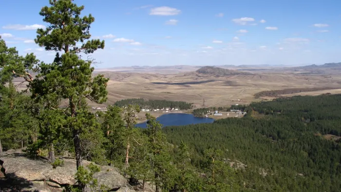 Lake and pine-covered hills in Karkaraly National Park