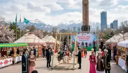 Kazakhstan flag and Nauryz table with traditional bread and tea symbolizing public holidays