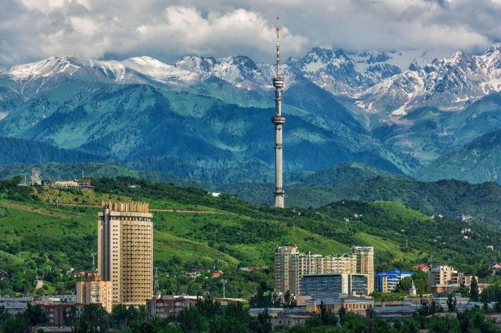 A panoramic view of Almaty city with majestic mountains in the background