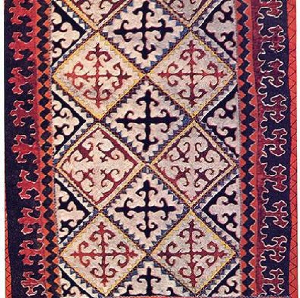 A traditional Tekemet, a handwoven Kazakhstan rug with geometric designs and natural hues.